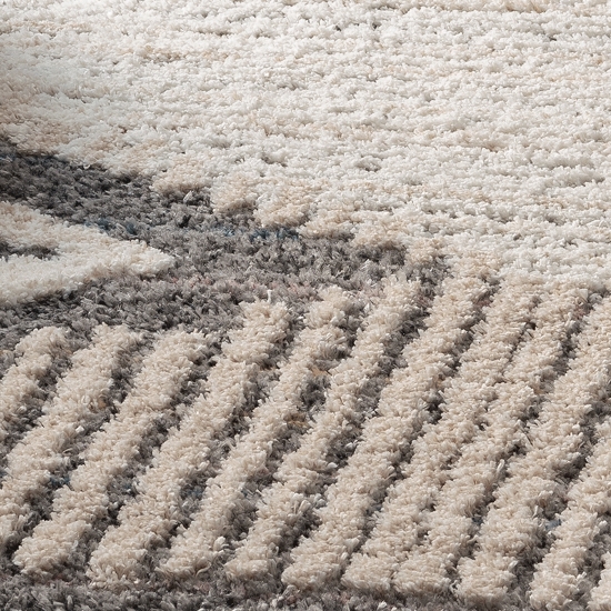 Preview: moderner Boho Teppich in legerem Rautenmuster in creme grau