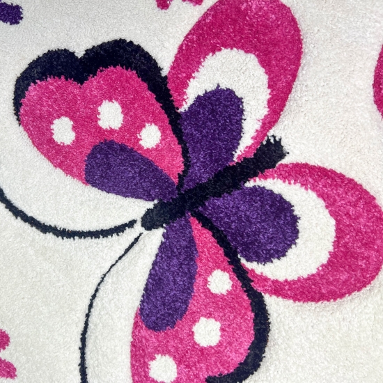 Preview: Teppich fürs Kinderzimmer mit Schmetterlingsmuster in creme pink läufer